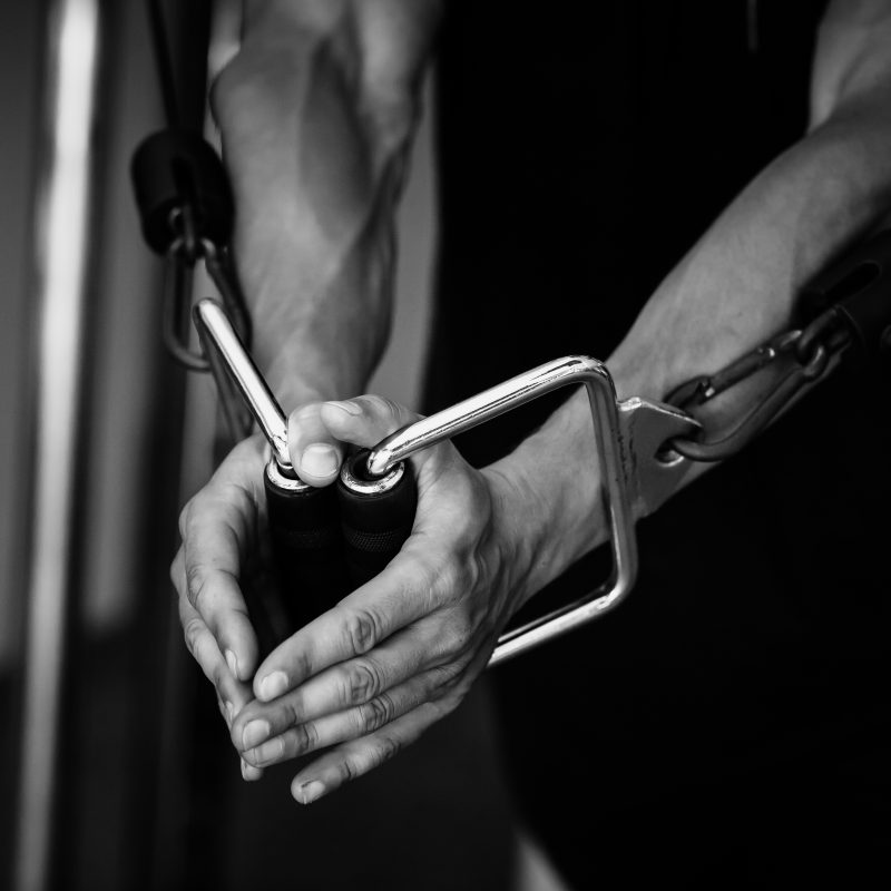 athletic man working out in a personal training gym in NYC